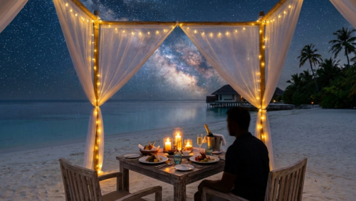 モルディブのビーチで楽しむ星空ディナー。満天の星とキャンドルに包まれた特別な夜の食事風景

