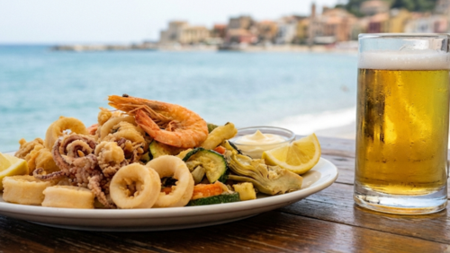 イタリアの海沿いで楽しむフリットミストと冷えたイタリア産ビールのセット